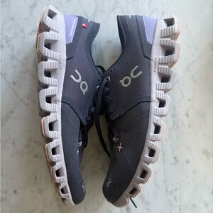 On Cloud X / Cloud X Shift (women’s) in a darker charcoal/lilac colorway